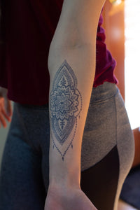 A dark jagua stain on a woman's back