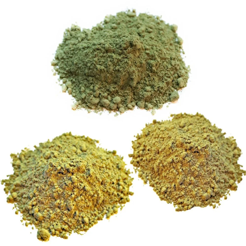 Three piles of fresh powdered herbs: henna, indigo and cassia