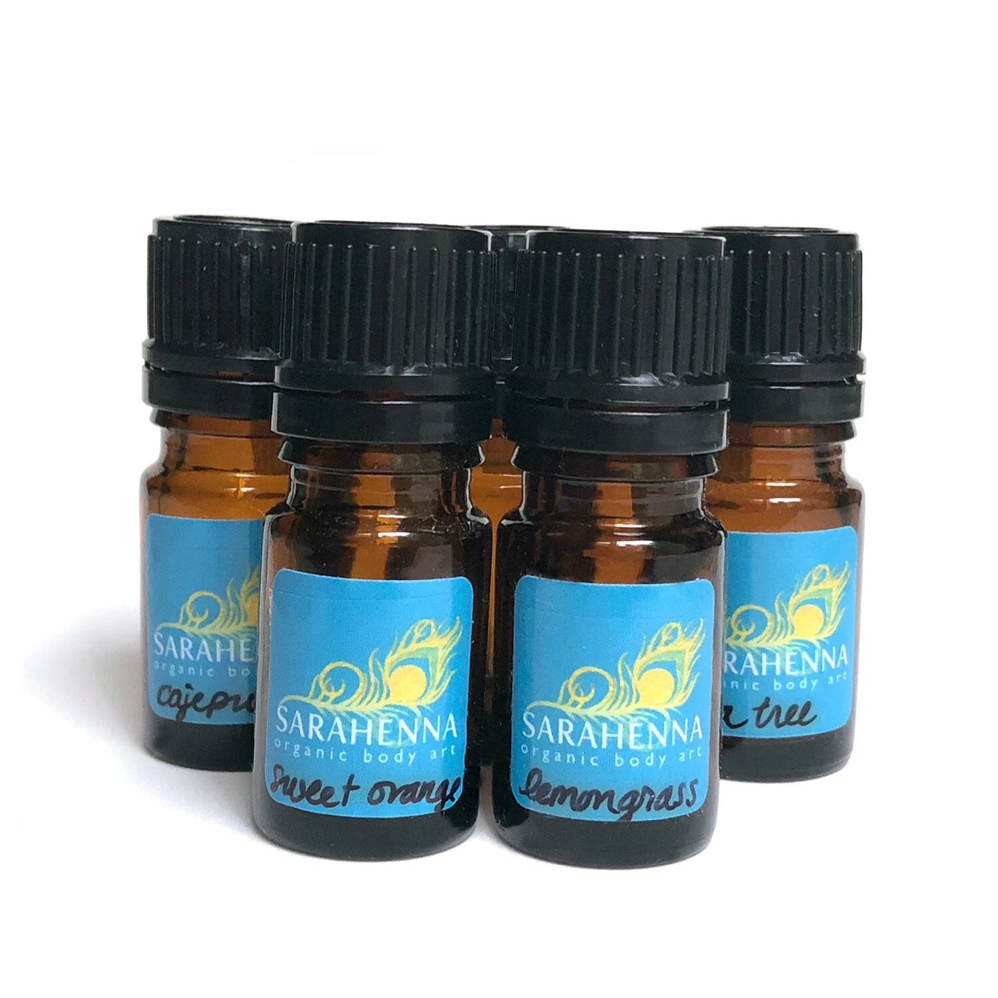A row of small bottles filled with essential oils