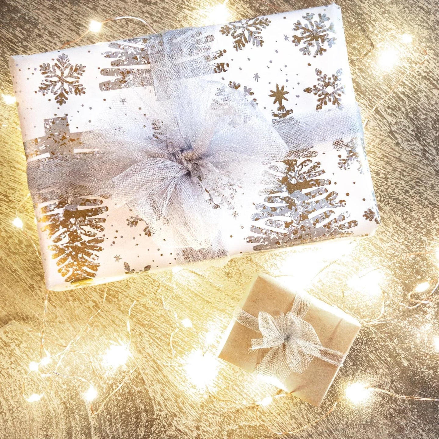 Two gift wrapped boxes with colorful ribbons