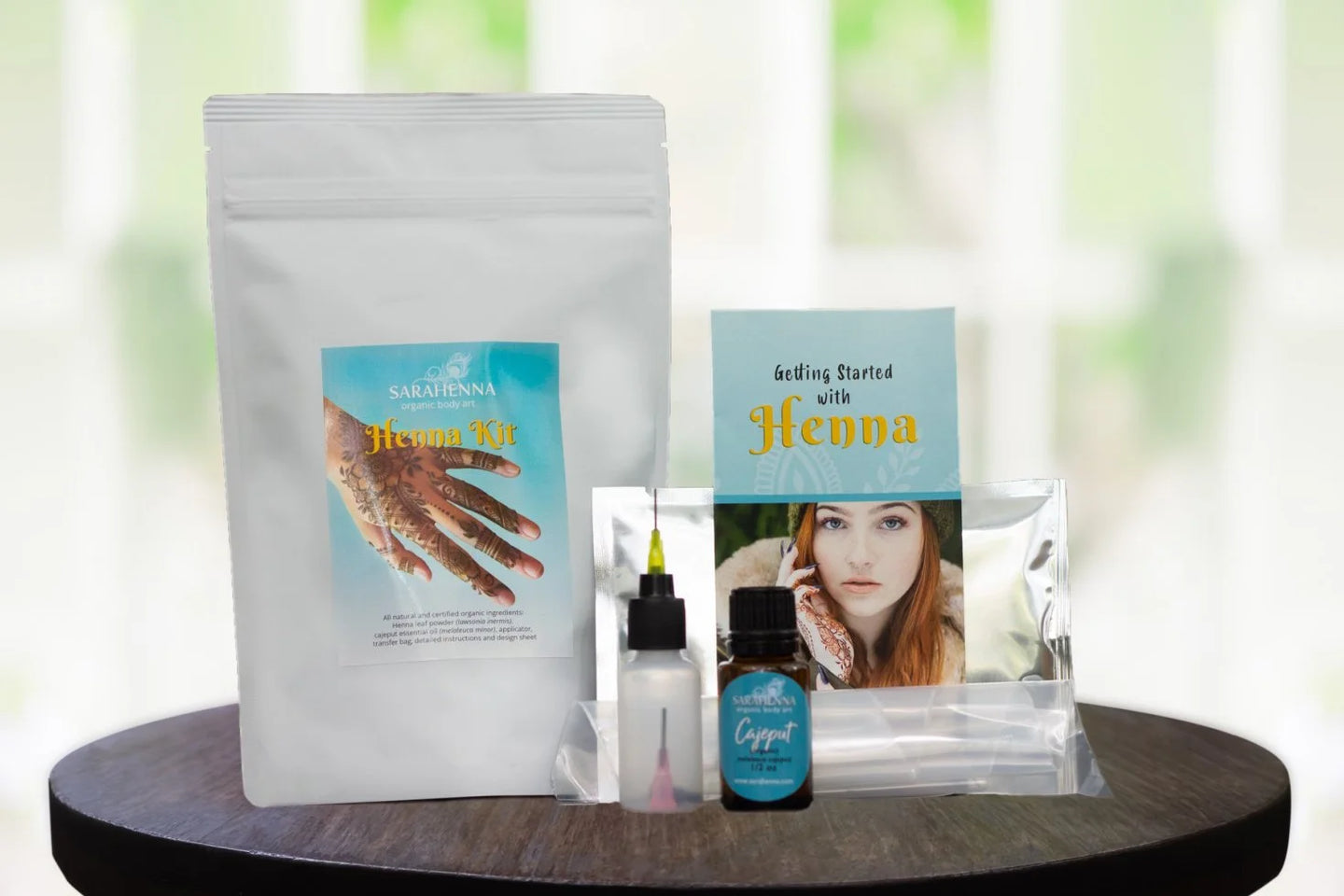The contents of a henna kit including organic henna powder and essential oils