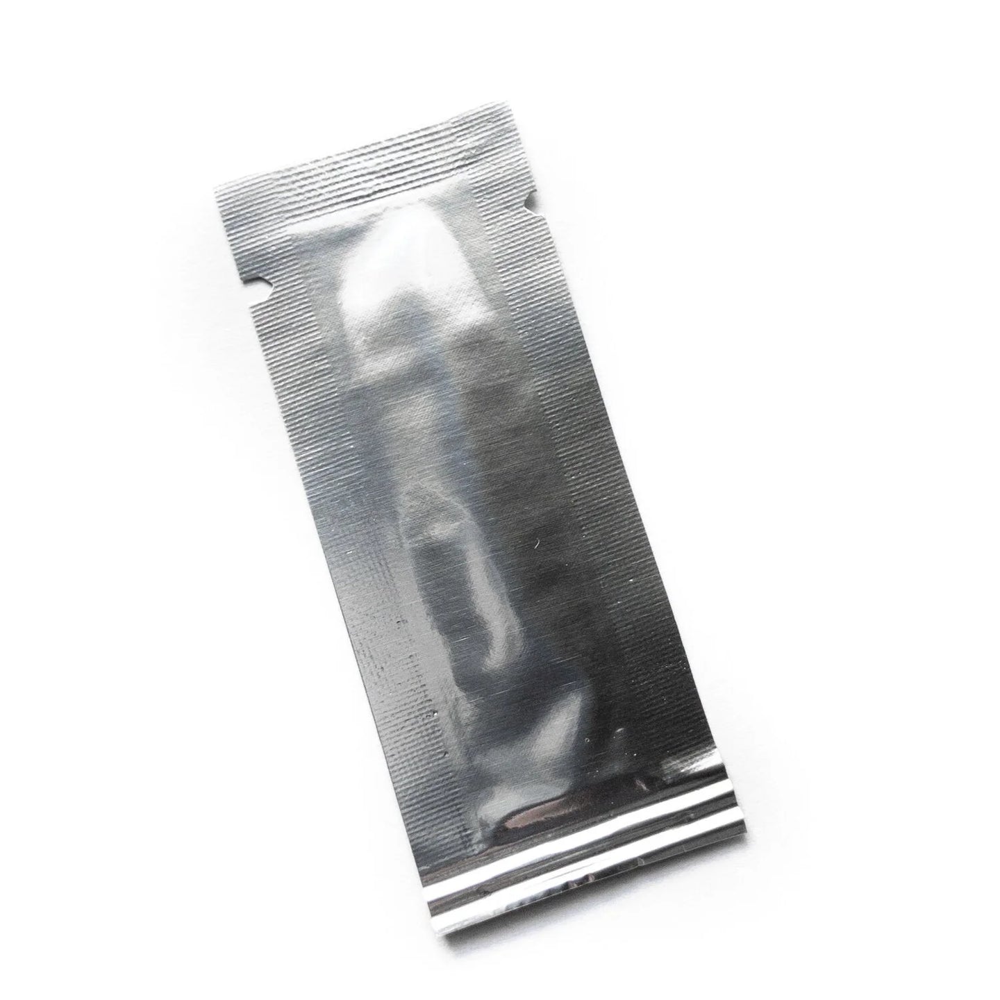 A small silver packet containing a sample of jagua gel
