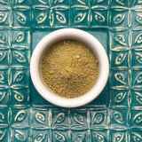 A bowl of fresh jagua henna powder