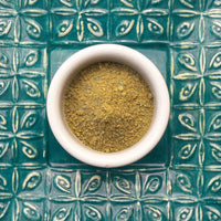 A bowl of fresh jagua henna powder