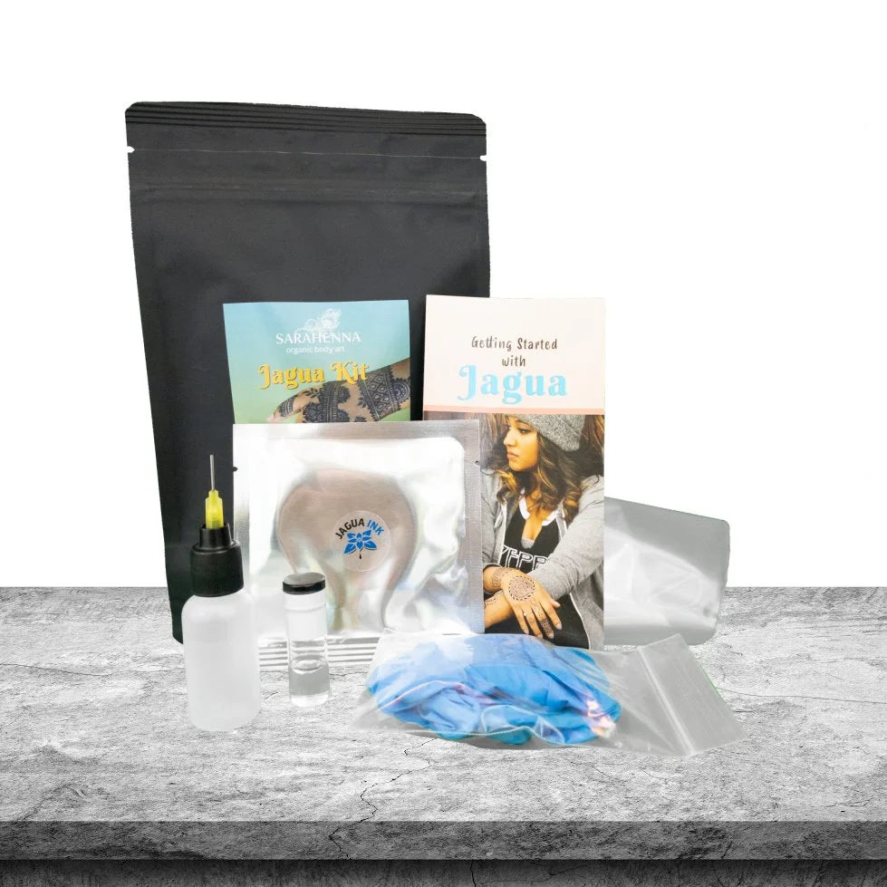 The contents of a jagua kit including jagua powder, essential oil and a how to do jagua ebook with instructions