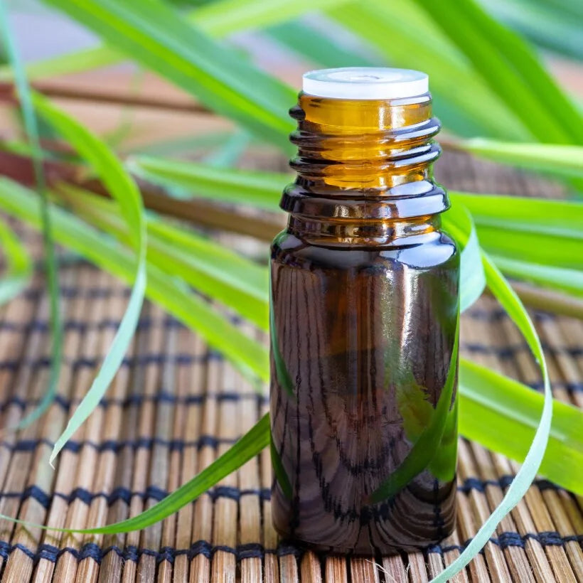 A glass bottle of lemongrass essential oil for mixing with henna