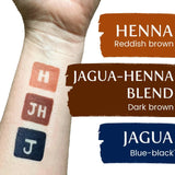 Three stains on an arm comparing the color differences between henna, jagua and jagua-henna