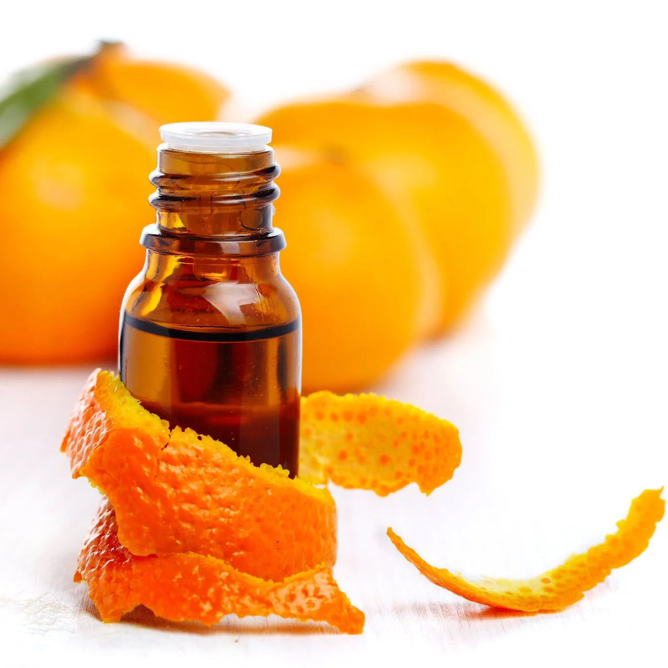 A glass bottle of sweet orange essential oil