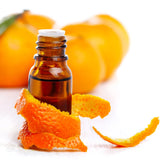A glass bottle of sweet orange essential oil