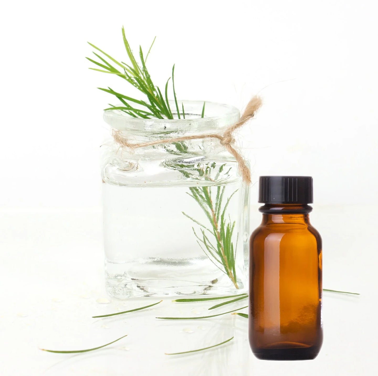 A glass bottle of tea tree essential oil