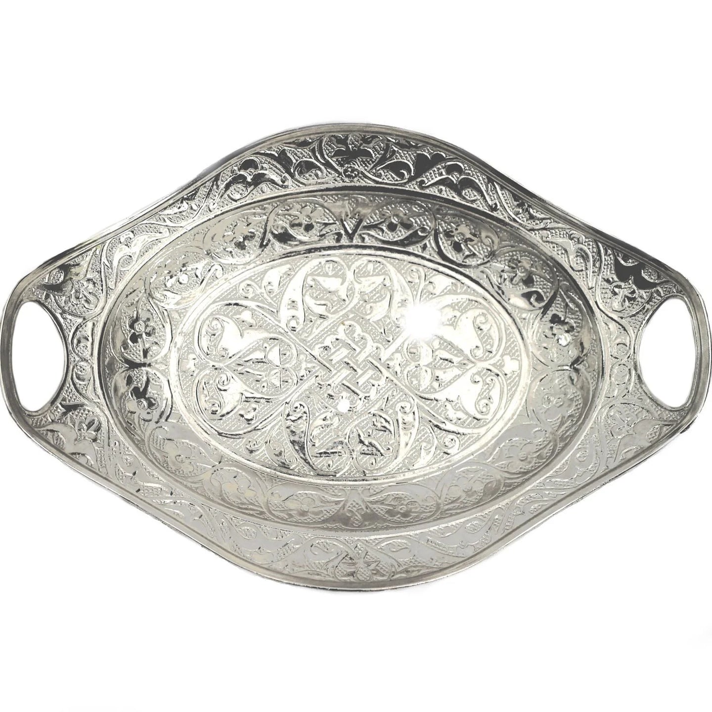 An intricate silver decorative tray with an oval shaped made in Turkey