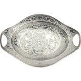 An intricate silver decorative tray with an oval shaped made in Turkey
