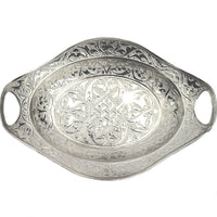 An intricate silver decorative tray with an oval shaped made in Turkey