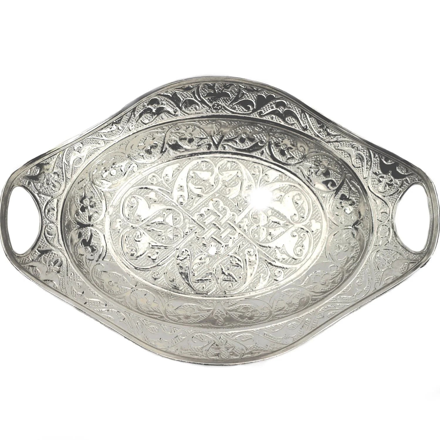 An intricate silver decorative tray with an oval shaped made in Turkey