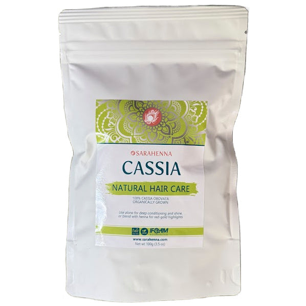 White packaging of Sarahenna Cassia natural hair care product on a white background