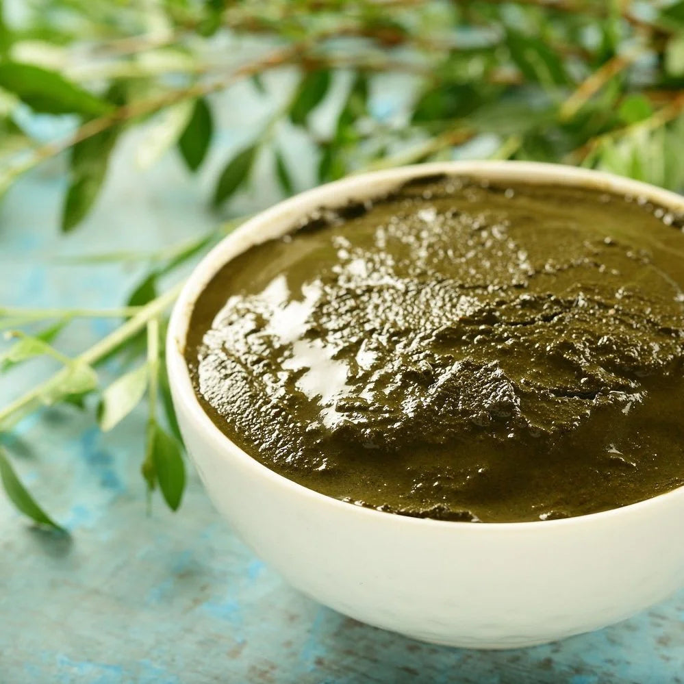A bowl of freshly mixed henna paste