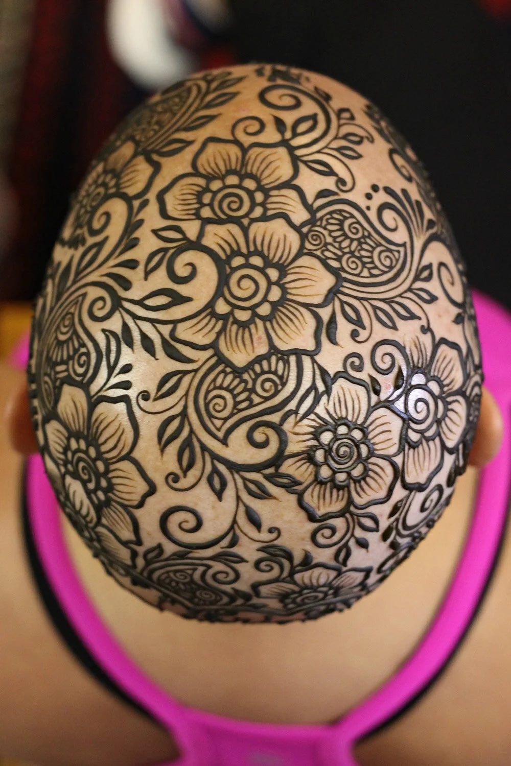 An intricate floral henna crown