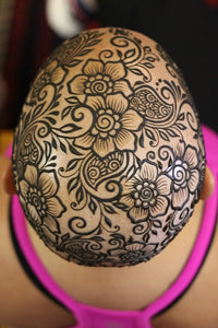 An intricate floral henna crown