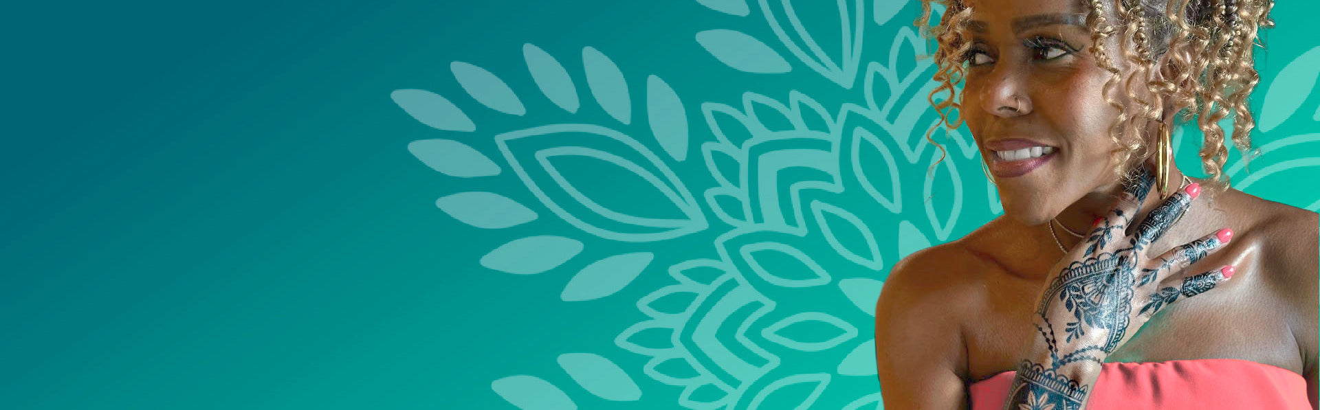 Woman with jagua temporary tattoos wearing a pink dress against a teal background with decorative patterns